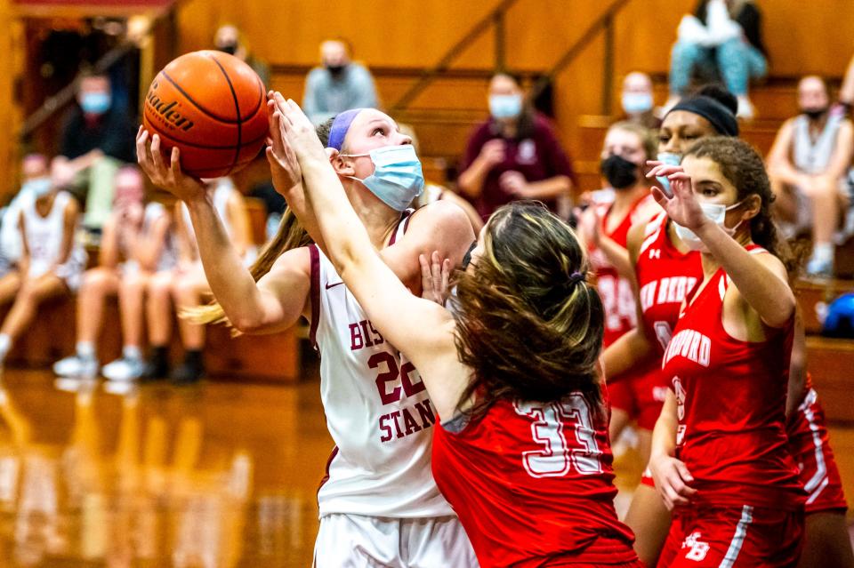 Bishop Stang's Kate Carreau gets the shot off and draws the foul.