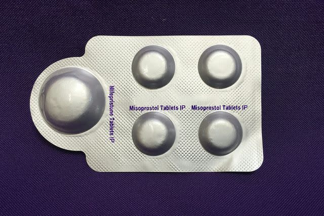 ELISA WELLS/PLAN C/AFP via Getty mifepristone (L) and misoprostol tablets