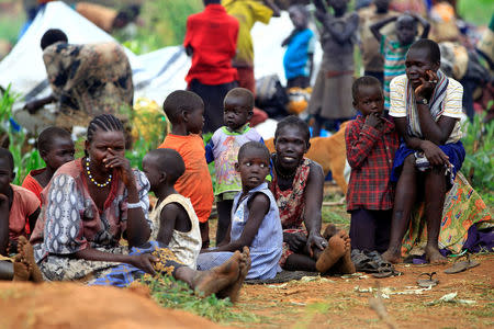 South Sudanese families displaced by fighting, queue for vaccination in Lamwo after fleeing fighting in Pajok town across the border in northern Uganda, April 5, 2017. REUTERS/James Akena