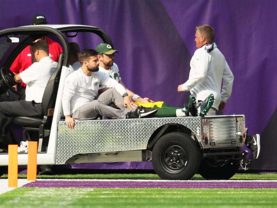 Aaron Rodgers is taken off injured on a cart after breaking his collarbone (Getty 2017)