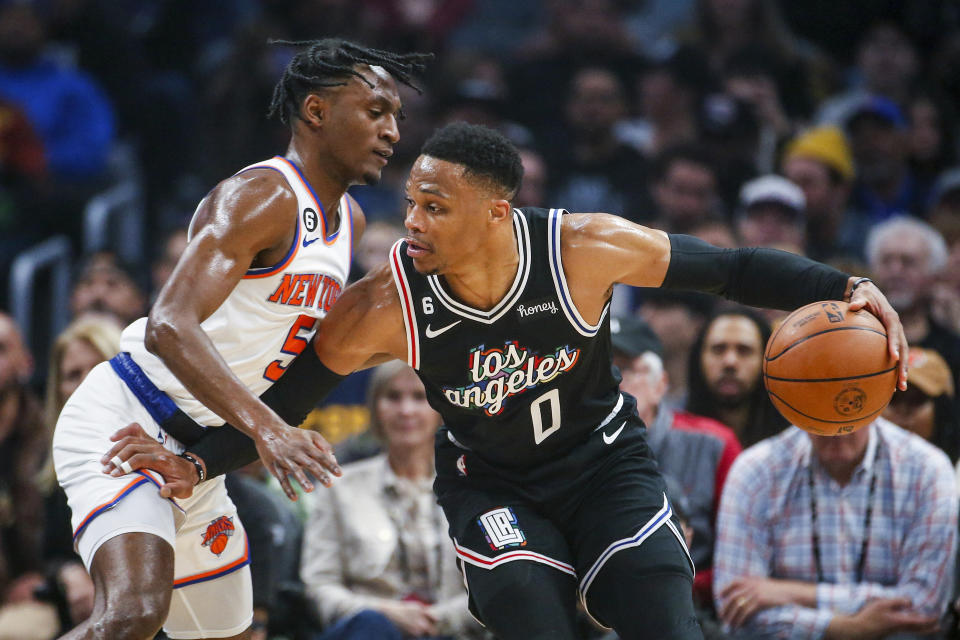 Los Angeles Clippers guard Russell Westbrook, right, drives against New York Knicks guard Immanuel Quckley during the first half of an NBA basketball game Saturday, March 11, 2023, in Los Angeles. (AP Photo/Ringo H.W. Chiu)