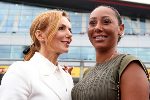 NORTHAMPTON, ENGLAND - JULY 14: Mel B and Geri Horner walk on the grid before the F1 Grand Prix of Great Britain at Silverstone on July 14, 2019 in Northampton, England. (Photo by Charles Coates/Getty Images)