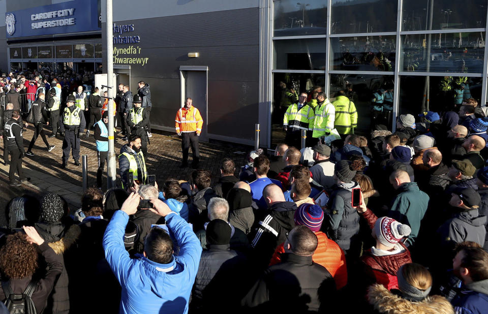 FILE - In this file photo dated Sunday Jan. 12, 2020, soccer fans crowd outside the Cardiff City soccer stadium ahead of the English Championship match against Swansea City, in Cardiff, Wales, as South Wales police are scheduled to test live facial recognition technology to monitor arriving fans for the soccer game. South Wales police deployed facial recognition surveillance equipment on Sunday Jan. 12, 2020, in a test to monitor crowds arriving for this weekend soccer match in real-time, which is prompting public debate about possible aggressive uses of facial recognition in Western democracies, raising questions about human rights and how the technology may enter people's daily lives in the future. (David Davies/PA via AP)