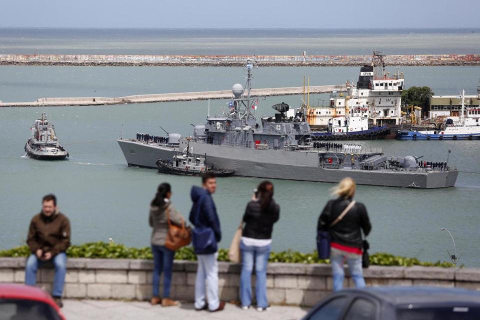 People watch over the vessel's base in Mar del Plata as they wait for news (AP)