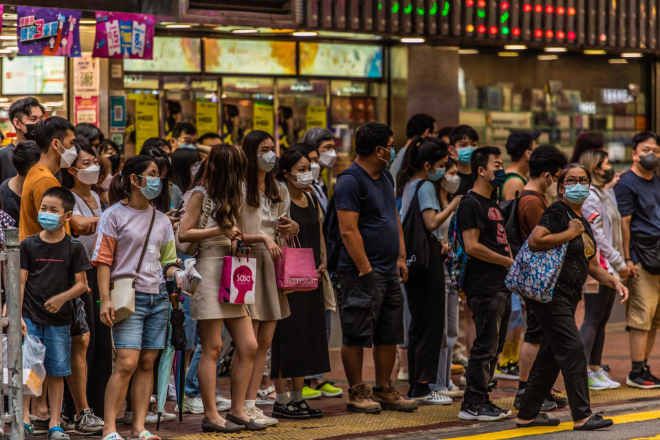 Hong Kong, China, 11 Jun 2022, People stack up at a street crossing in Mongkok. (Photo by Marc Fernandes/NurPhoto via Getty Images)