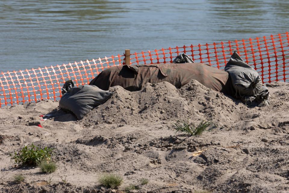 Unexploded bombs from WWII are seen on dry waters in Italy's Po river on August 4, 2022.