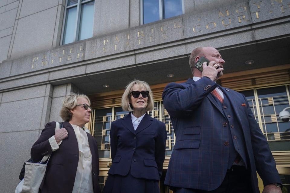Former advice columnist E. Jean Carroll, center, leaves federal court with members of her legal team, after testifying in her rape trial against former President Donald Trump, Wednesday April 26, 2023, in New York (AP)