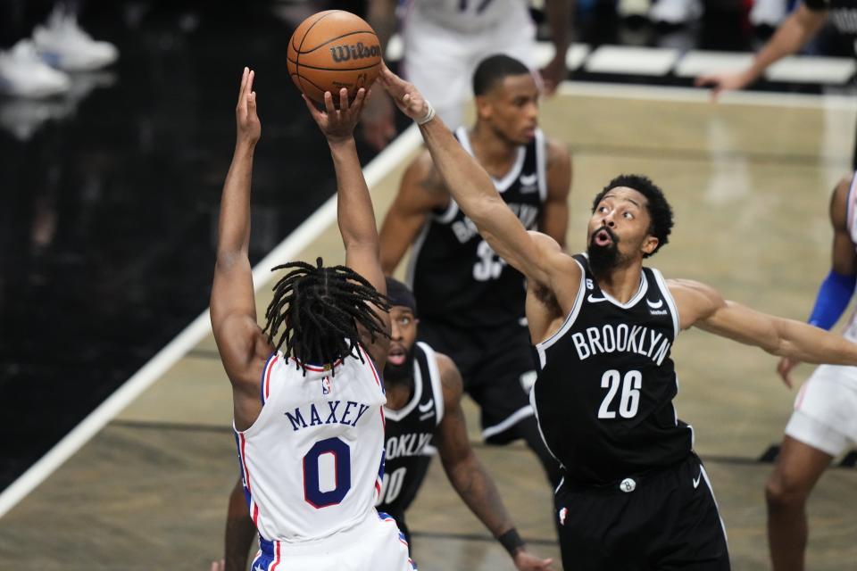Brooklyn Nets' Spencer Dinwiddie (26) blocks a shot by Philadelphia 76ers' Tyrese Maxey (0) during the second half of Game 4 in an NBA basketball first-round playoff series Saturday, April 22, 2023, in New York. The 76ers won 96-88. (AP Photo/Frank Franklin II)
