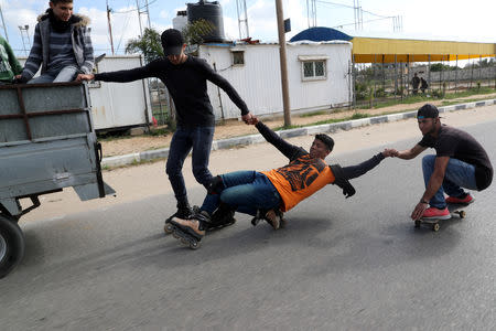 Members of Gaza Skating Team, Mohammad Al-Sawalhe, 23, and Mustafa Sarhan, 19, practice their rollerblading and skating skills in Gaza City March 10, 2019. REUTERS/Mohammed Salem