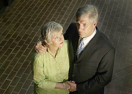 Tom Umberg stands with his arm around wife Robin Umberg.