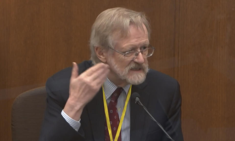 In this image from video, Dr. Martin Tobin testifies as Hennepin County Judge Peter Cahill presides Thursday, April 8, 2021, in the trial of former Minneapolis police Officer Derek Chauvin at the Hennepin County Courthouse in Minneapolis, Minn. Chauvin is charged in the May 25, 2020 death of George Floyd. (Court TV via AP, Pool)