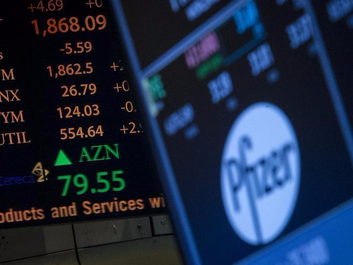 The ticker symbol for AstraZeneca is displayed next to a ticker for Pfizer on the floor of the New York Stock Exchange April 28, 2014. REUTERS/Brendan McDermid