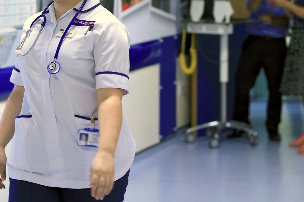 A nurse walks on a ward (stock image)  (PA Archive)