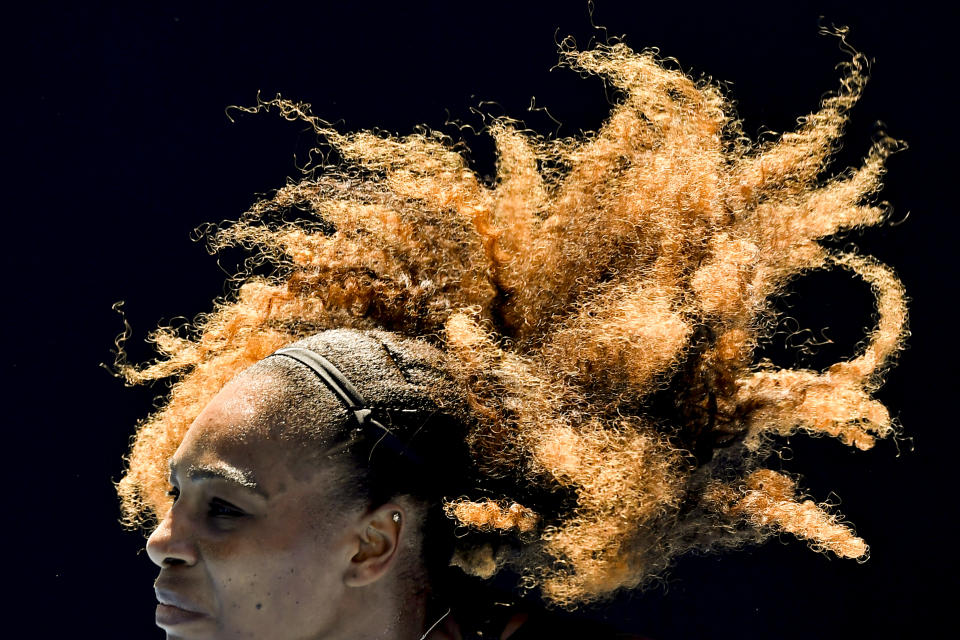 FILE - United States' Serena Williams serves to compatriot Nicole Gibbs during their third round match at the Australian Open tennis championship, Saturday, Jan. 21, 2017, in Melbourne, Australia. After nearly three decades in the public eye, few can match Serena Williams' array of accomplishments, medals and awards. Through it all, the 23-time Grand Slam title winner hasn't let the public forget that she's a Black American woman who embraces her responsibility as a beacon for her people. (AP Photo/Andy Brownbill, File)