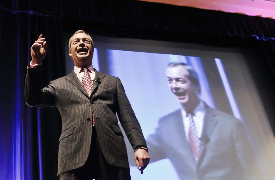 The UK Independence Party leader, Nigel Farage, delivers a speech on stage at the UKIP Spring Conference 2014 held at the Riviera International Conference Centre, Torquay, England, Saturday March 1, 2014. The UK Independence Party claims its support is growing throughout Britain ahead of European Parliament elections in May. The upstart party led by Nigel Farage hopes to capitalize on anti-European Union and anti-immigrant sentiments. At public meetings at the end of its two-day conference in southwest England Saturday, Farage said UKIP is winning voters tired of the political elite. (AP Photo/PA, Ben Birchall) UNITED KINGDOM OUT NO SALES NO ARCHIVE