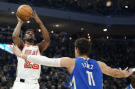 Miami Heat's Jimmy Butler shoots over Milwaukee Bucks' Brook Lopez (11) during the first half of an NBA basketball game Saturday, Feb. 4, 2023, in Milwaukee. (AP Photo/Aaron Gash)