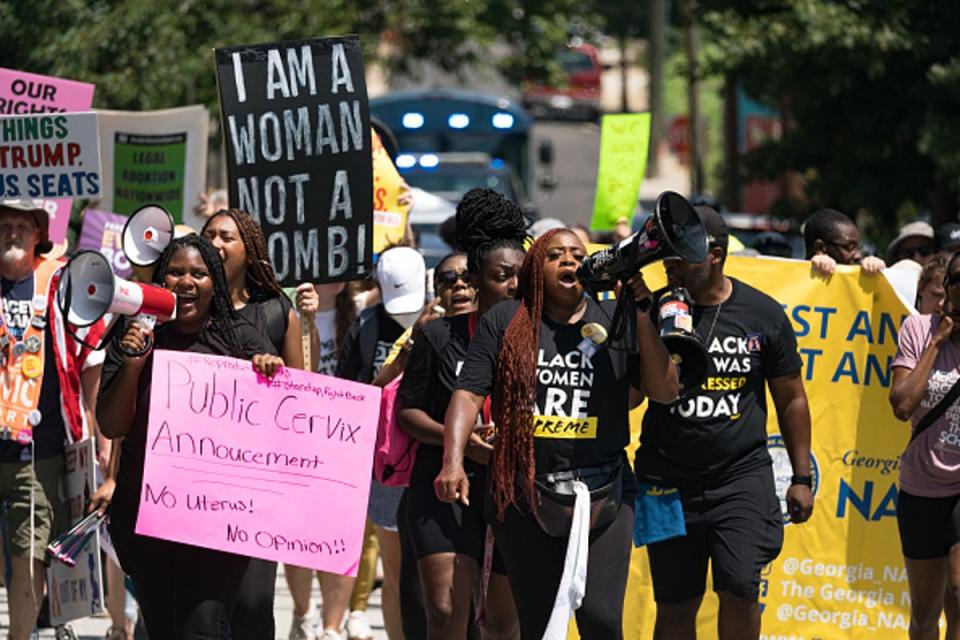 Protestors march and chant in Downtown Atlanta, in opposition to Georgia's new abortion law on July 23, 2022 (Getty Images)