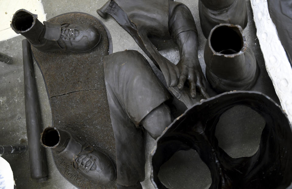 Wax molds for a Jackie Robinson sculpture are arranged on the floor at Art Castings of Colorado in Loveland, Colo. on Wednesday, May 8, 2024. The original statue was cut off at the ankles and stolen from a park in Wichita, Kansas in January. The Colorado foundry cast that sculpture in 2019 and, luckily, still had the original plaster and rubber molds. (AP Photo/Thomas Peipert)