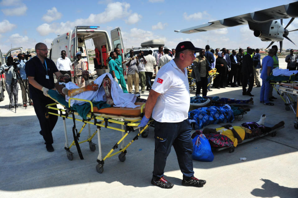 Ambulance staff hurry to save victims