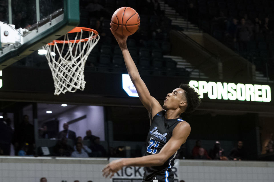 FILE - In this Dec. 9, 2019, file photo, Ypsilanti Lincoln's Emoni Bates shoots against River Rouge during the Tip Off Classic high school basketball game in Ypsilanti, Mich. Bates, part of a top-ranked Memphis class, was named the Gatorade national high school player of the year in 2020. (Nicole Hester/Ann Arbor News via AP, File)