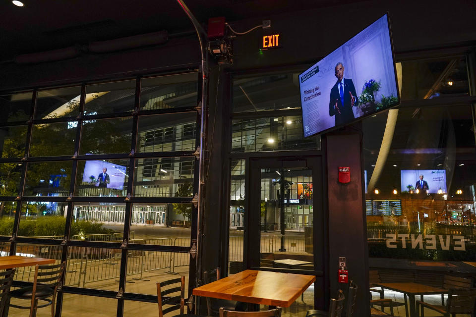 A television screen at Goodcity Brewing shows former President Barack Obama speaking to the Democratic National Convention, across from Fiserv Forum on Wednesday, Aug. 19, 2020, in Milwaukee. (AP Photo/Morry Gash)