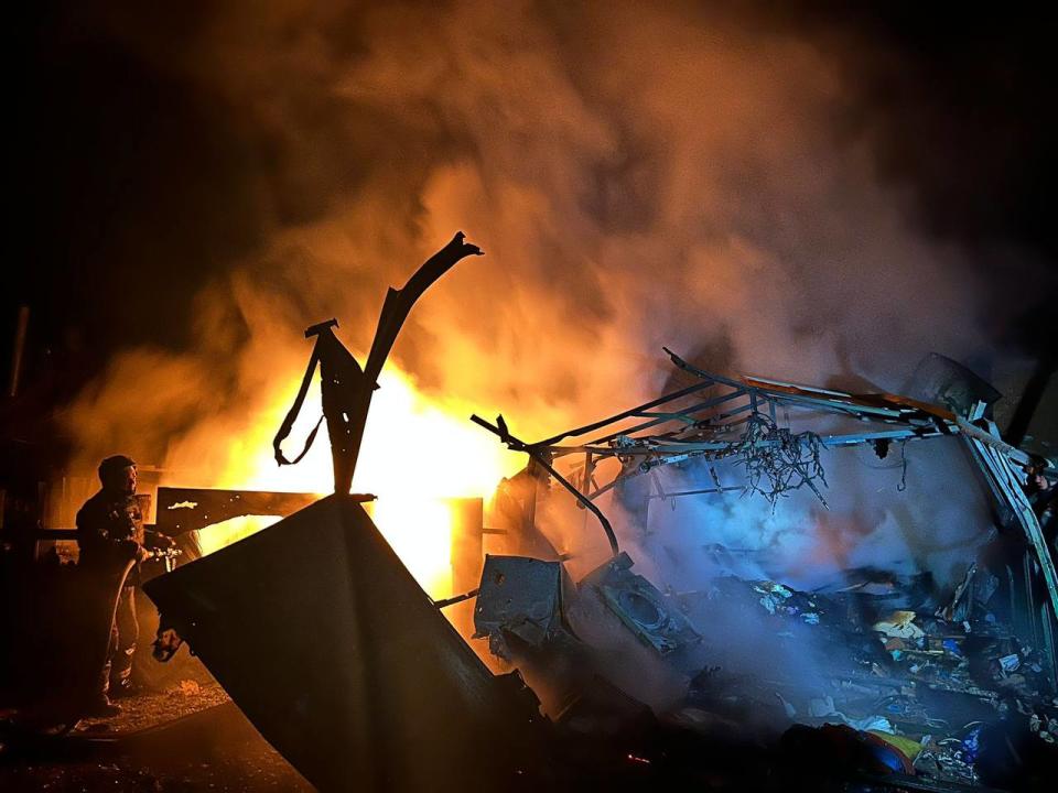 A Ukrainian firefighter tackles a fire in Kharkiv Oblast (Telegram / Oleg Sinegubov)