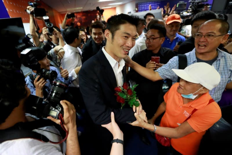 Future Forward Party leader Thanathorn Juangroongruangkit greets his supporters at the party's headquarters in Bangkok