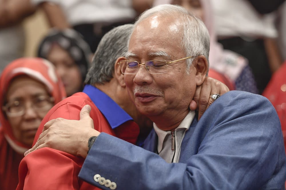 Datuk Seri Zahid Hamidi hugs Datuk Seri Najib Razak during a press conference in Kuala Lumpur May 12, 2018. — Picture by Mukhriz Hazim