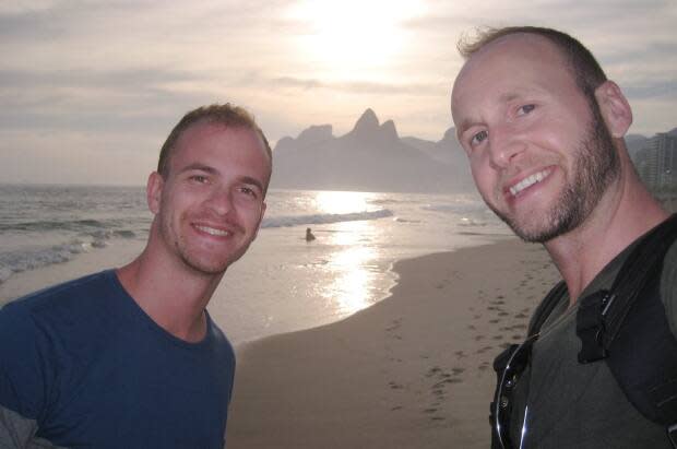 Hopeful parents Lucas de Flavia, left, and Jonathan Hobin, right, are pictured here in de Flavia's native country of Brazil in 2014. (Submitted by Jonathan Hobin - image credit)