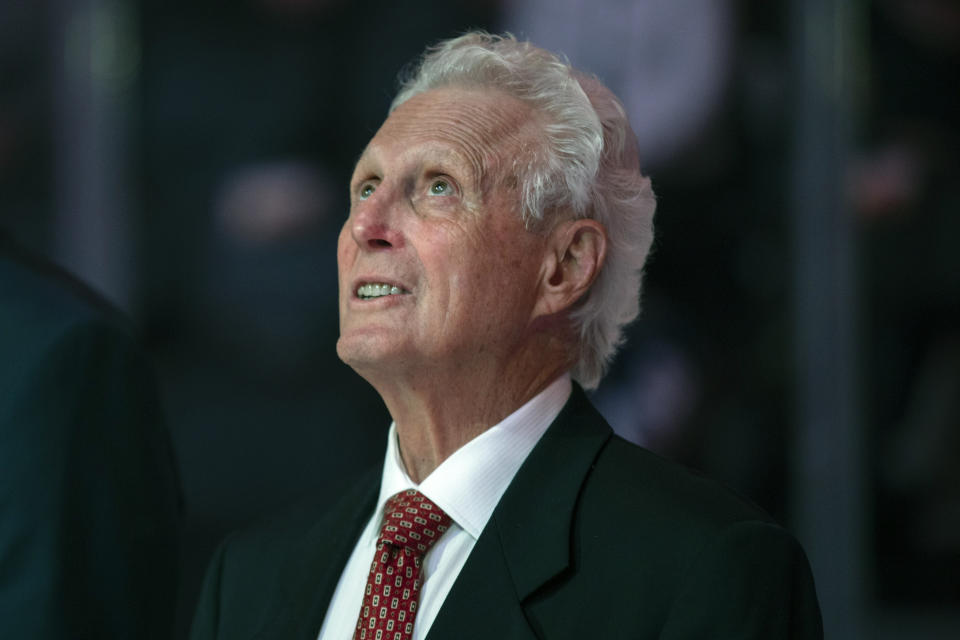 FILE - Paul Henderson watches the videoboard during a pregame ceremony to commemorate the 50th anniversary of Team Canada's victory in the 1972 Summit Series, prior to a preseason NHL hockey game between the Montreal Canadiens and the Toronto Maple Leafs in Toronto on Wednesday, Sept. 28, 2022. Henderson, a former NHLer who will always be remembered for scoring the decisive goal in clinching Canada its Summit Series win over Russia some 50 years ago, will get more recognition on Saturday, when he'll celebrate his 80th birthday with a ceremonial puck drop before Cansius' game against Niagara. Henderson's grandson, Alton McDermott, is a left wing for Canisius. (Nick Iwanyshyn/The Canadian Press via AP, File)