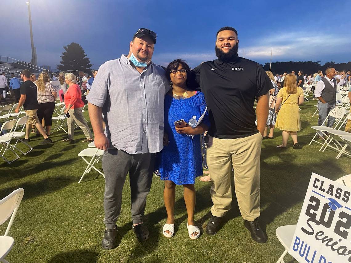 Duke football defensive lineman Ja’Mion Franklin (far right) with his parents, James and Latoya Franklin, who have both been stricken with cancer and other serious health issues.