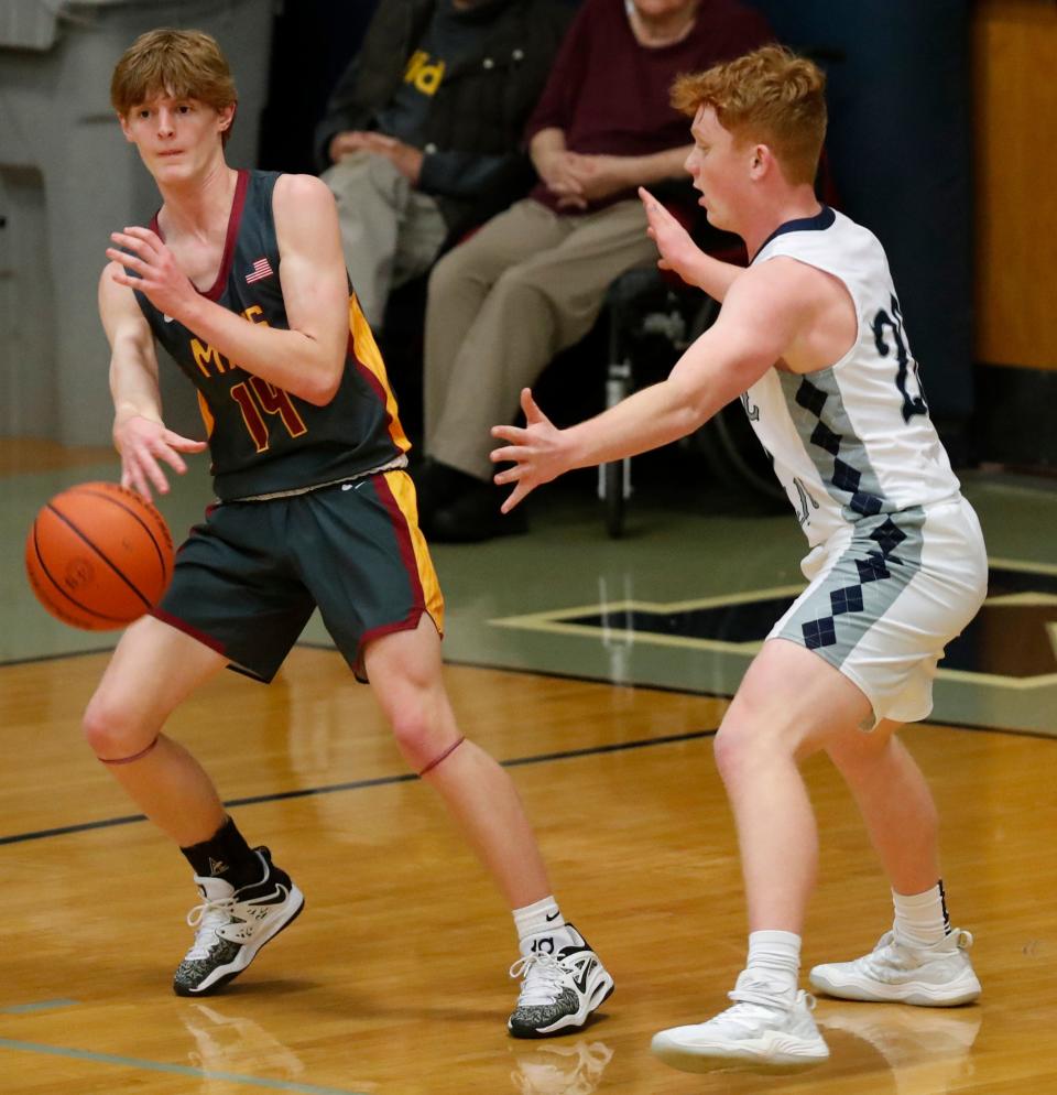 McCutcheon Mavericks Owen Souligne (14) passes the ball during the IHSAA boy’s basketball game against the Central Catholic Knights, Friday, Jan. 6, 2023, at Central Catholic High School in Lafayette, Ind. Central Catholic won 64-54.