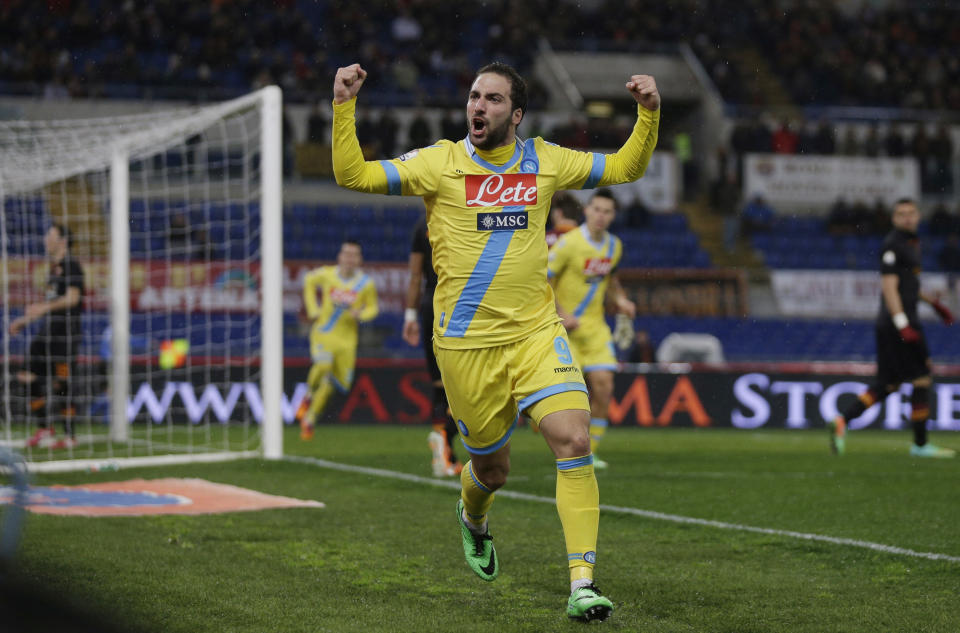 Napoli's Gonzalo Higuain celebrates after scoring during an Italian Cup, semifinal first leg match, between AS Roma and Napoli at Rome's Olympic stadium, Wednesday, Feb. 5, 2014. (AP Photo/Alessandra Tarantino)
