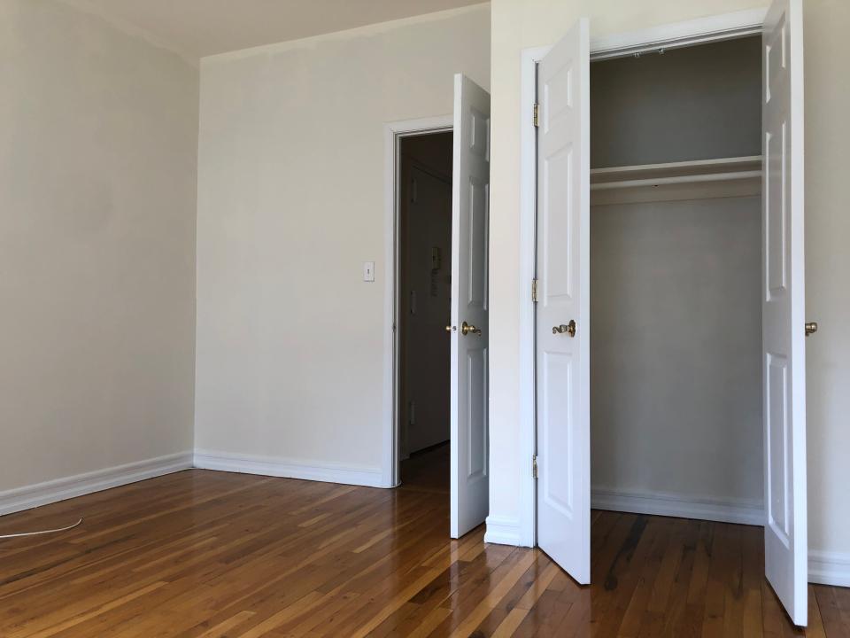 the bedroom and closet in a new york city apartment for rent