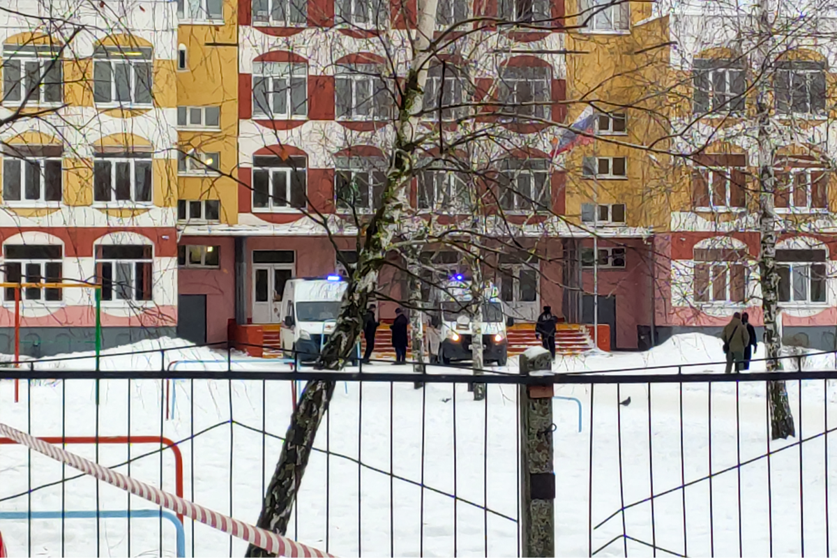 Emergency vehicles are seen on the grounds of Gymnasium Number Five following a shooting, in Bryansk (Kommersant Photo/AFP via Getty I)