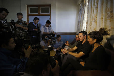 Israeli trekkers Maya Ora (R) along with Yakov Megreli (2nd R) and Linor Kajan (3rd R), who were rescued from an avalanche by the Nepalese army, speak to the media at the Army Hospital where they are undergoing treatment in Kathmandu October 16, 2014. REUTERS/Navesh Chitrakar