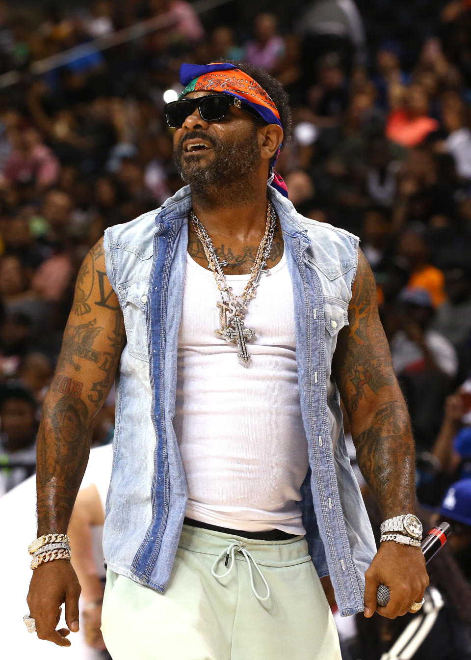 Jim Jones Wearing Denim Jacket And Tank Top