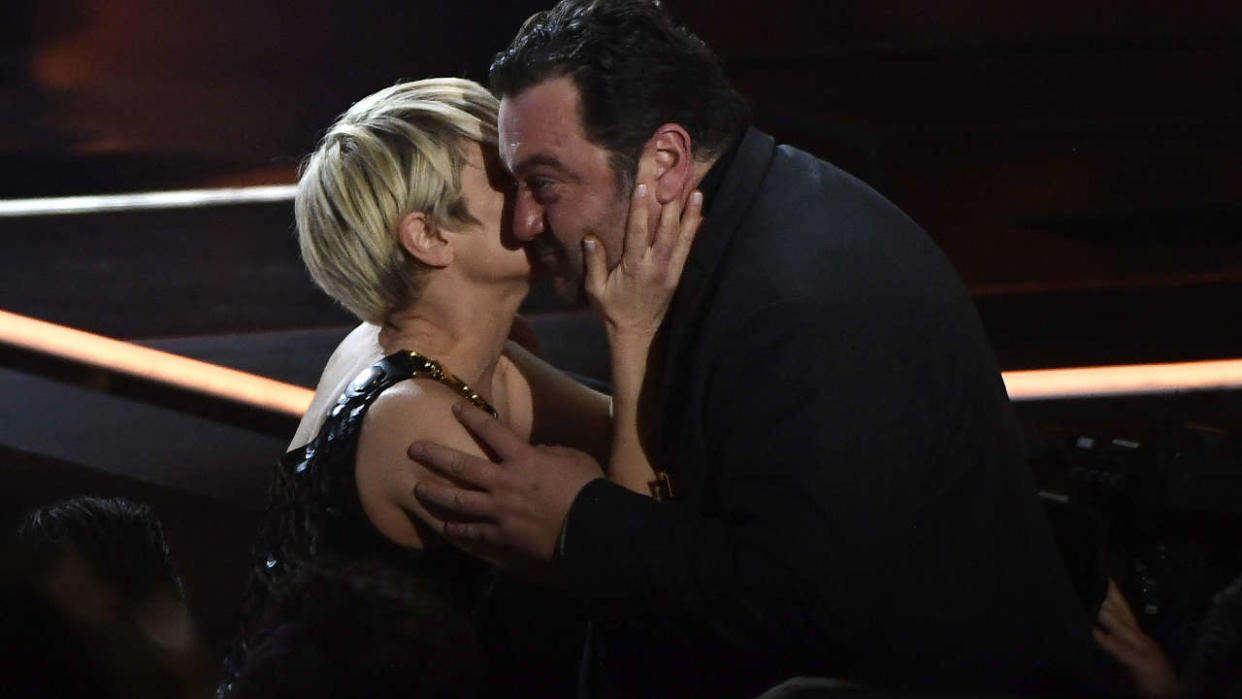 French actor Denis Menochet (R) reacts to receiving the Goya to the best actor for his role in 