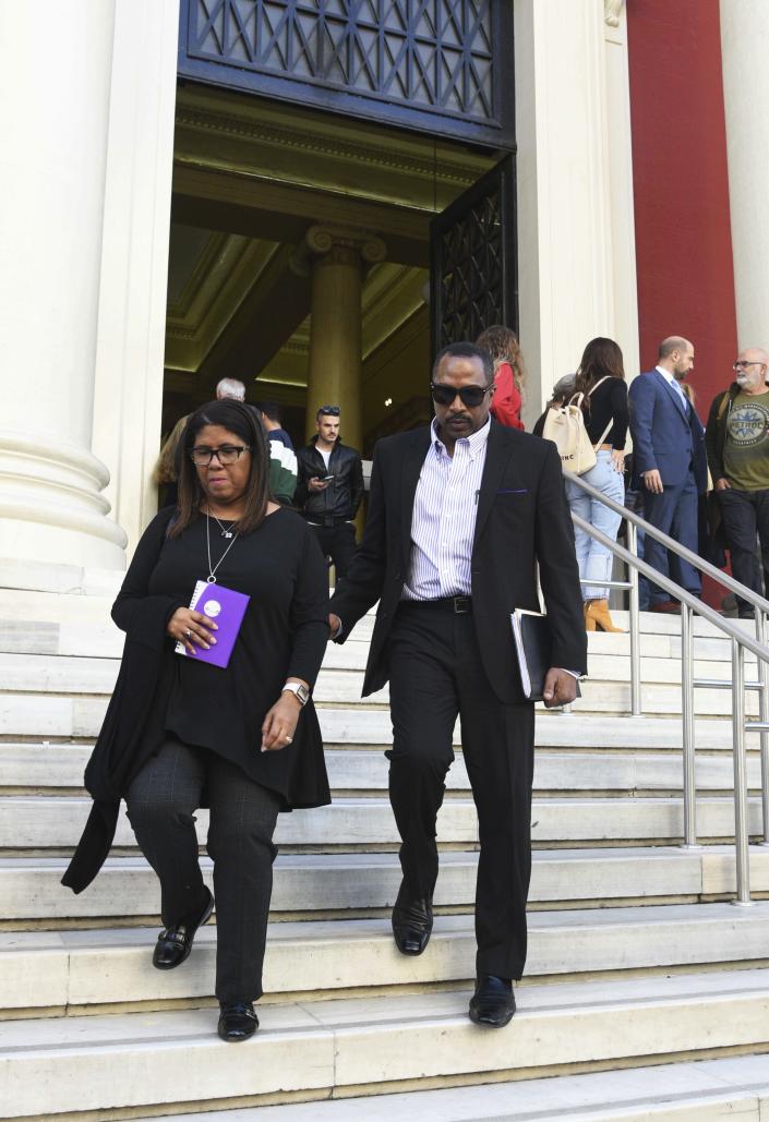 Phil Henderson and his wife Jill leave a court house in Patras, Greece , on Thursday, Nov. 22, 2018. Greek court on Thursday convicted and sentenced six of nine suspects in the fatal beating of an American tourist in an island resort last year, handing down sentences of five to 15 years on reduced charges of deliberate bodily harm. Bakari Henderson, a 22-year-old of Austin, Texas, died after being beaten in the street following an argument in a bar in the popular Laganas resort area of Zakynthos island in July 2017. (AP Photo/Giannis Androutsopoulos)
