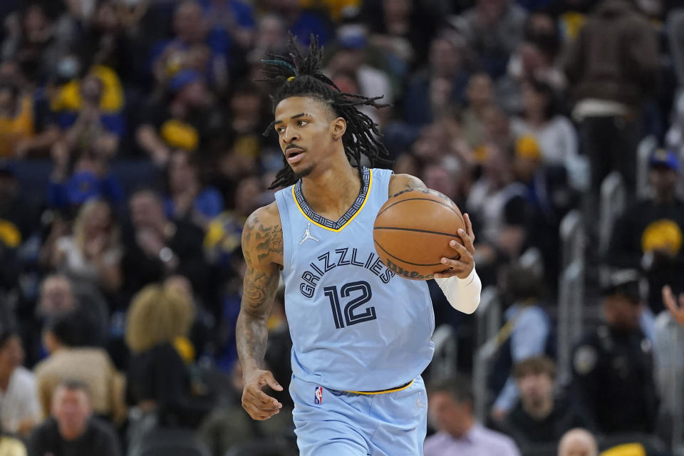 Memphis Grizzlies guard Ja Morant brings the ball up against the Golden State Warriors during the second half of Game 3 of an NBA basketball Western Conference playoff semifinal in San Francisco, Saturday, May 7, 2022. (AP Photo/Jeff Chiu)