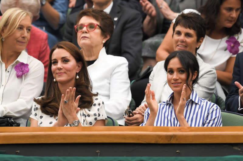 The Duchess of Cambridge and the Duchess of Sussex take a seat at Wimbledon for the Ladies Single Finals. [Photo: Rex]