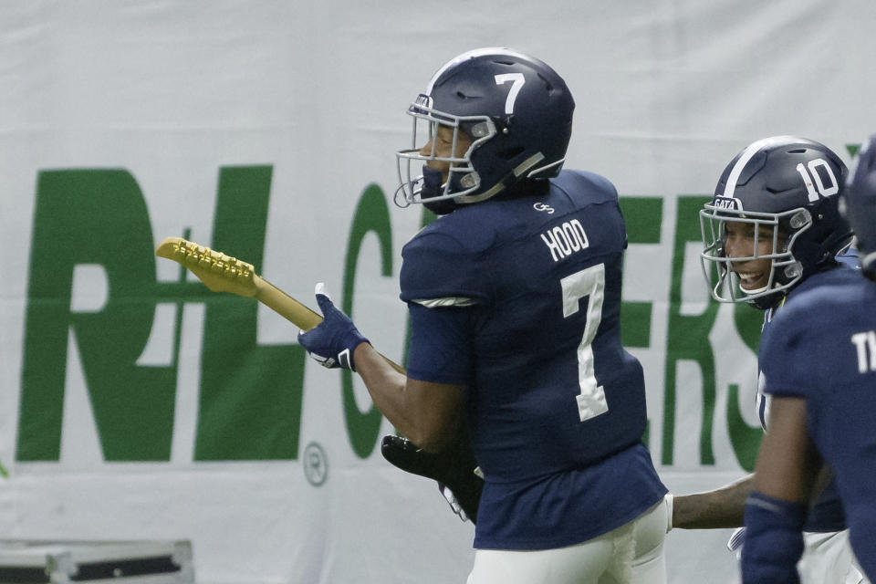 Georgia Southern wide receiver Khaleb Hood (7) holds a guitar as he celebrates a touchdown against Louisiana Tech during the first half of the New Orleans Bowl NCAA college football game in New Orleans, Wednesday, Dec. 23, 2020. (AP Photo/Matthew Hinton)