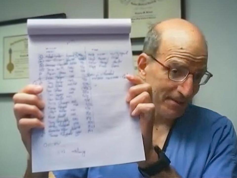 Dr. Greg Hirsch keeps his wait-list for heart surgery on his desk so he knows who to call as soon as a space opens up in an operating room. He says he doesn't know the timeline for anyone beyond the top five.  (CBC - image credit)