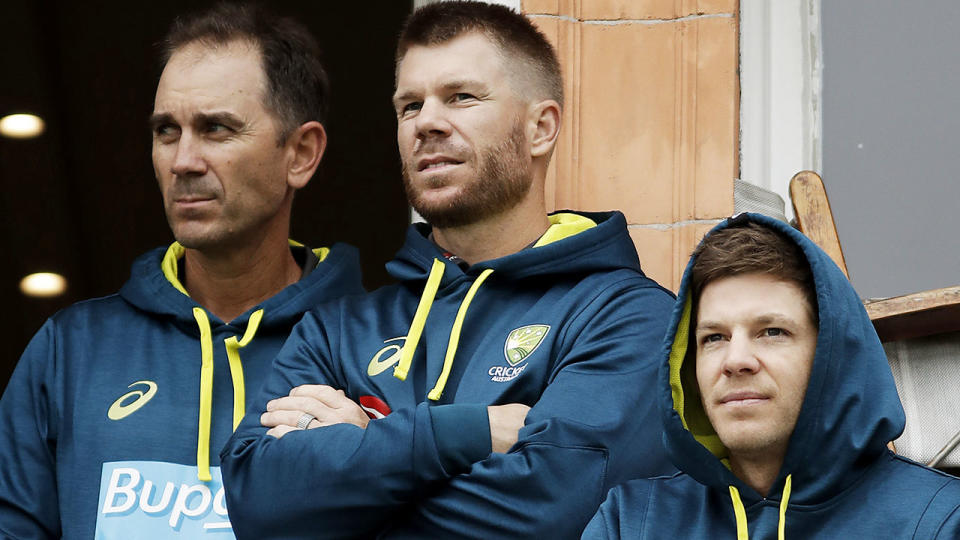 Justin Langer, David Warner and Tim Paine look on as rain delays the start of play. (Photo by Ryan Pierse/Getty Images)