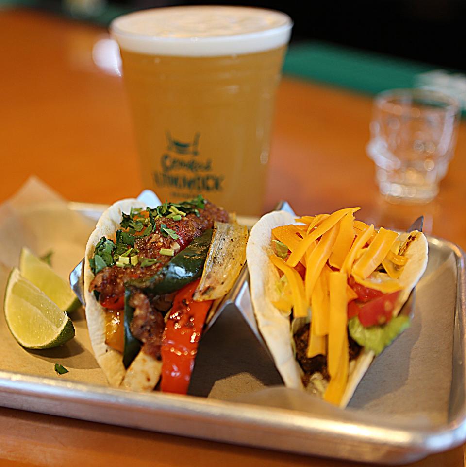 A chicken fajita taco (left) along with a ground beef taco are paired with Crooked Hammock Brewery's new Joint Collaboration beer at Taco Reho in Middletown.