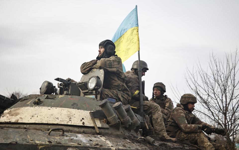 Ukrainian servicemen take positions on the frontline at an undisclosed location in the Donetsk region, Ukraine, Friday, Nov. 24, 2022. (AP Photo/Roman Chop)