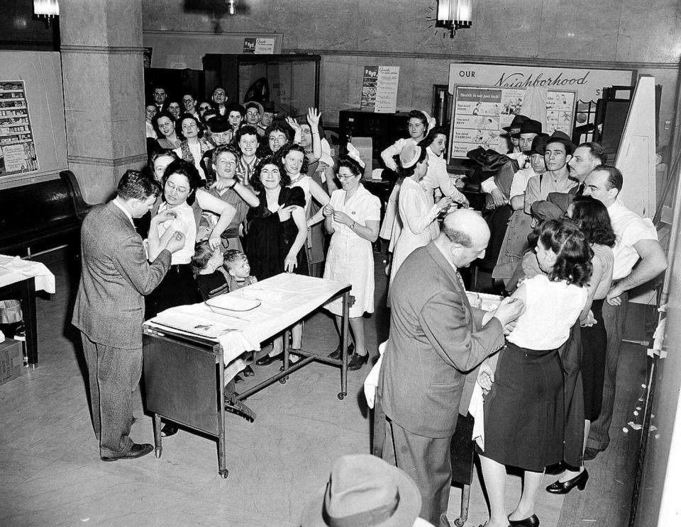 People crowd into a room to be vaccinated for smallpox in New York City in 1947.