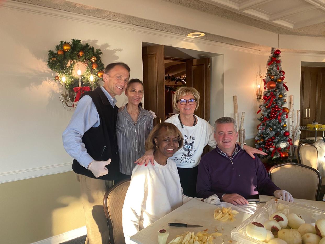 From left, Brad Simmons, Beth Ardisana, Shirley Stancato, Sandy Pierce and Terry Rhadigan make pies for friends and community organizations on Nov. 22, 2022, at Meadowbrook Country Club.
