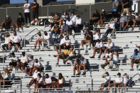 Davis fans sit in the stands during a high school football game against Herriman on Thursday, Aug. 13, 2020, in Herriman, Utah. Utah is among the states going forward with high school football this fall despite concerns about the ongoing COVID-19 pandemic that led other states and many college football conferences to postpone games in hopes of instead playing in the spring. (AP Photo/Rick Bowmer)