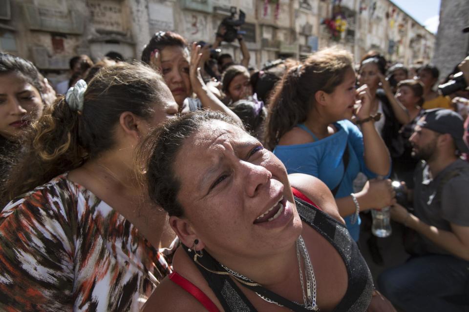 Women cry during a burial of 14-year-old Madelyn Patricia Hernandez Hernandez, a girl who died in a fire at the Virgin of the Assumption Safe Home, at the Guatemala City's cemetery, Friday, March 10, 2017. Families began burying some of the 36 girls killed in a fire at an overcrowded government-run youth shelter in Guatemala as authorities worked to determine exactly what happened. (AP Photo/Moises Castillo)